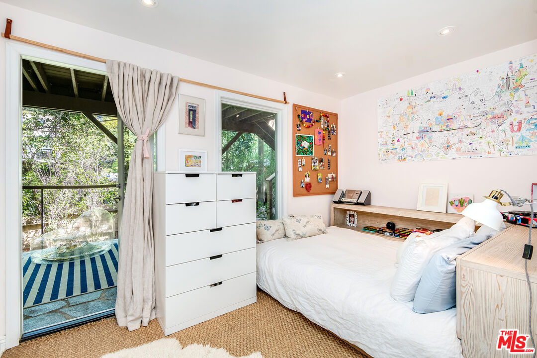 3152 Ellington Drive Los Angeles, CA 90068 - Photo 16 of 21 a bedroom with a bed and a window