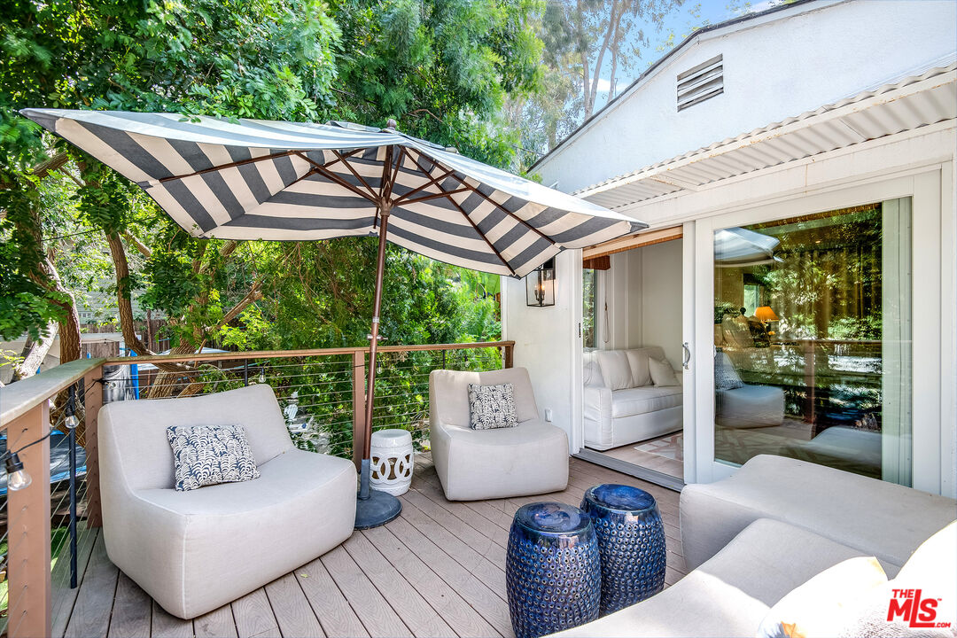 3152 Ellington Drive Los Angeles, CA 90068 - Photo 19 of 21 a view of a patio with couches chairs and a table and chairs