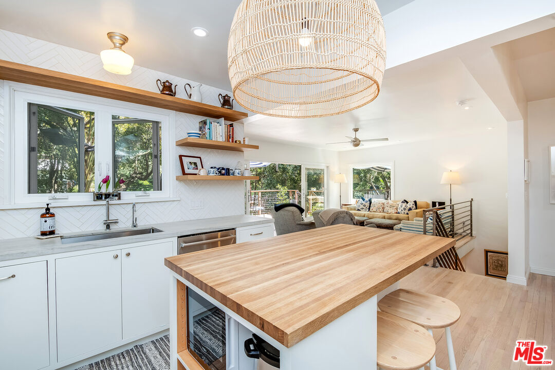 3152 Ellington Drive Los Angeles, CA 90068 - Photo 4 of 21 a kitchen with a table chairs and a chandelier