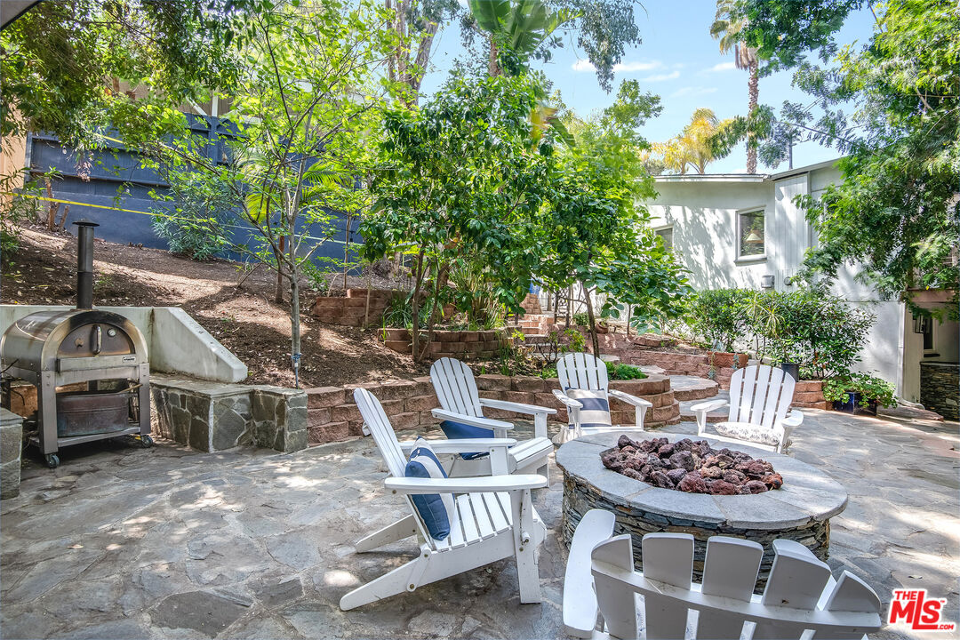 3152 Ellington Drive Los Angeles, CA 90068 - Photo 10 of 21 a view of a patio with table and chairs and potted plants