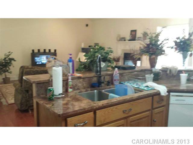 2220 Starnes Road Edgemoor, SC 29712 - Photo 8 of 13 a kitchen with a sink and cabinets