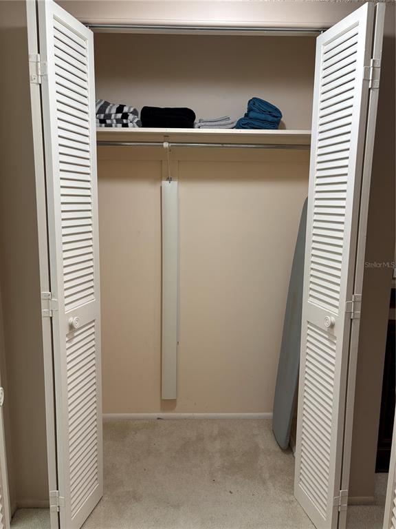 4750 Cove Circle, Unit 904 St. Petersburg, FL 33708 - Photo 18 of 37 a room with storage and utility