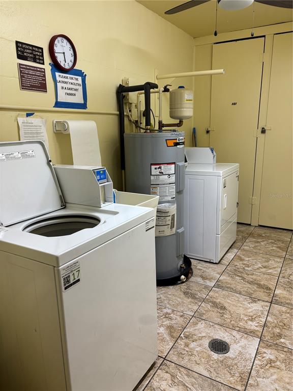 4750 Cove Circle, Unit 904 St. Petersburg, FL 33708 - Photo 26 of 37 a utility room with dryer and washer