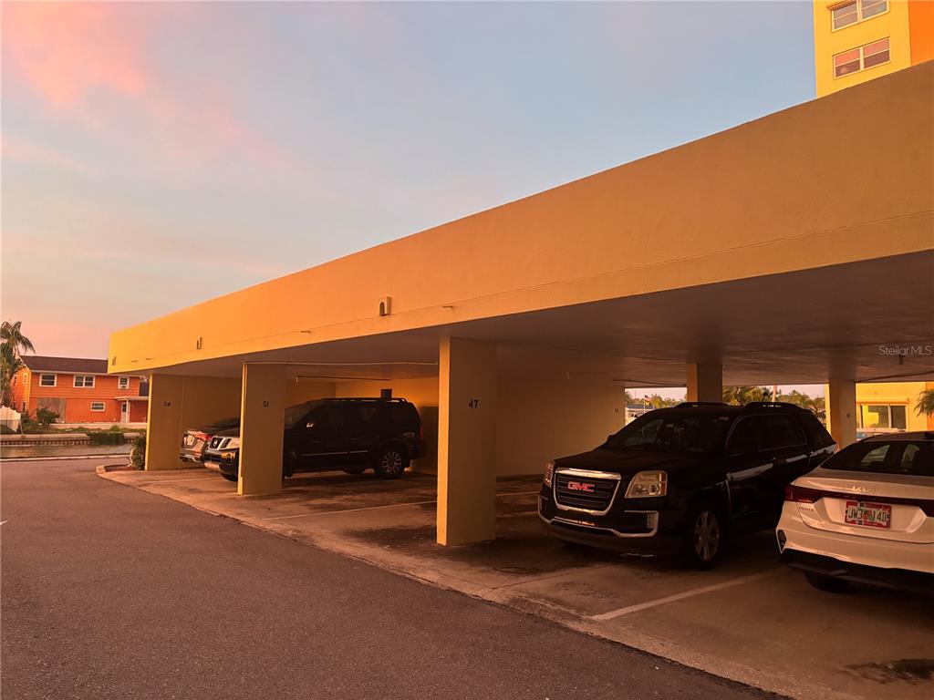 4750 Cove Circle, Unit 904 St. Petersburg, FL 33708 - Photo 27 of 37 a car parked in front of a building