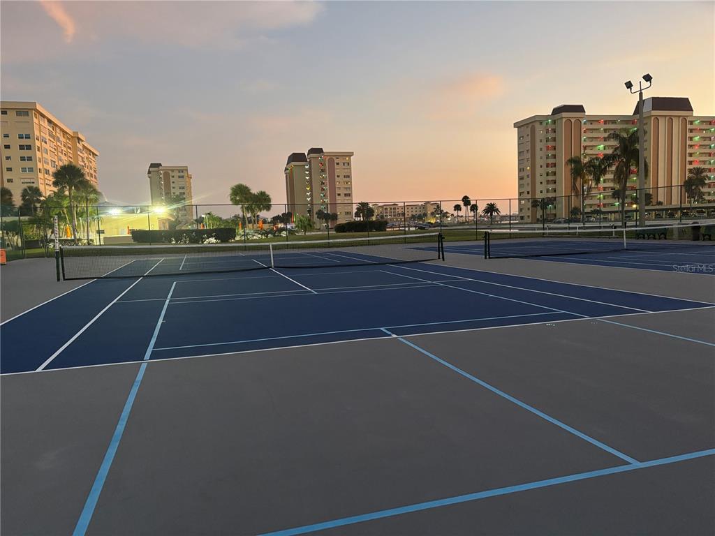 4750 Cove Circle, Unit 904 St. Petersburg, FL 33708 - Photo 29 of 37 a view of a tennis court