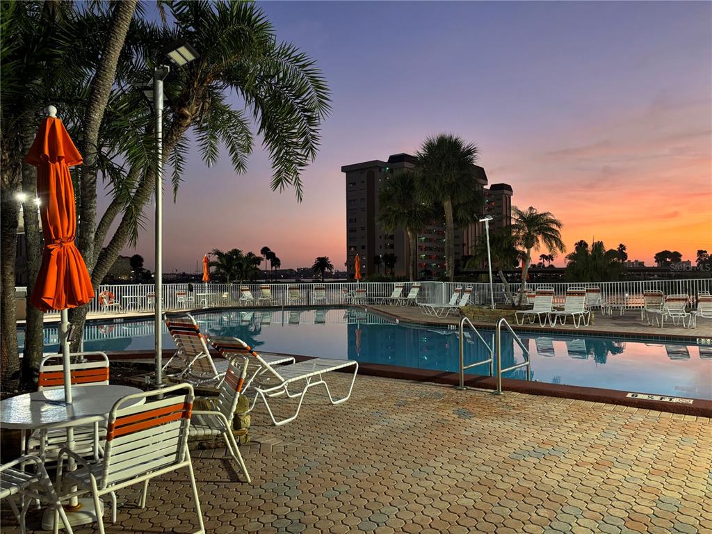 4750 Cove Circle, Unit 904 St. Petersburg, FL 33708 - Photo 33 of 37 a terrace with outdoor seating and city view