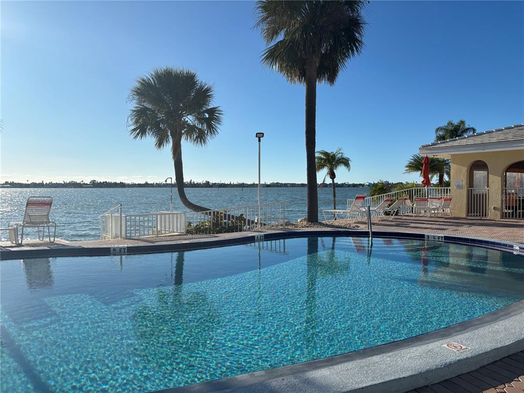 4750 Cove Circle, Unit 904 St. Petersburg, FL 33708 - Photo 36 of 37 a swimming pool view with a lake view