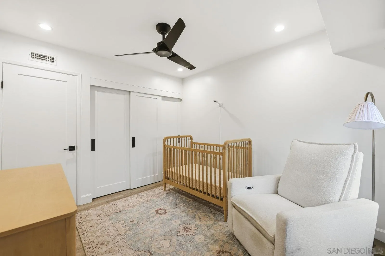 1422 Caminito Septimo Cardiff, CA 92007 - Photo 17 of 27 a bedroom with a couch and a rug