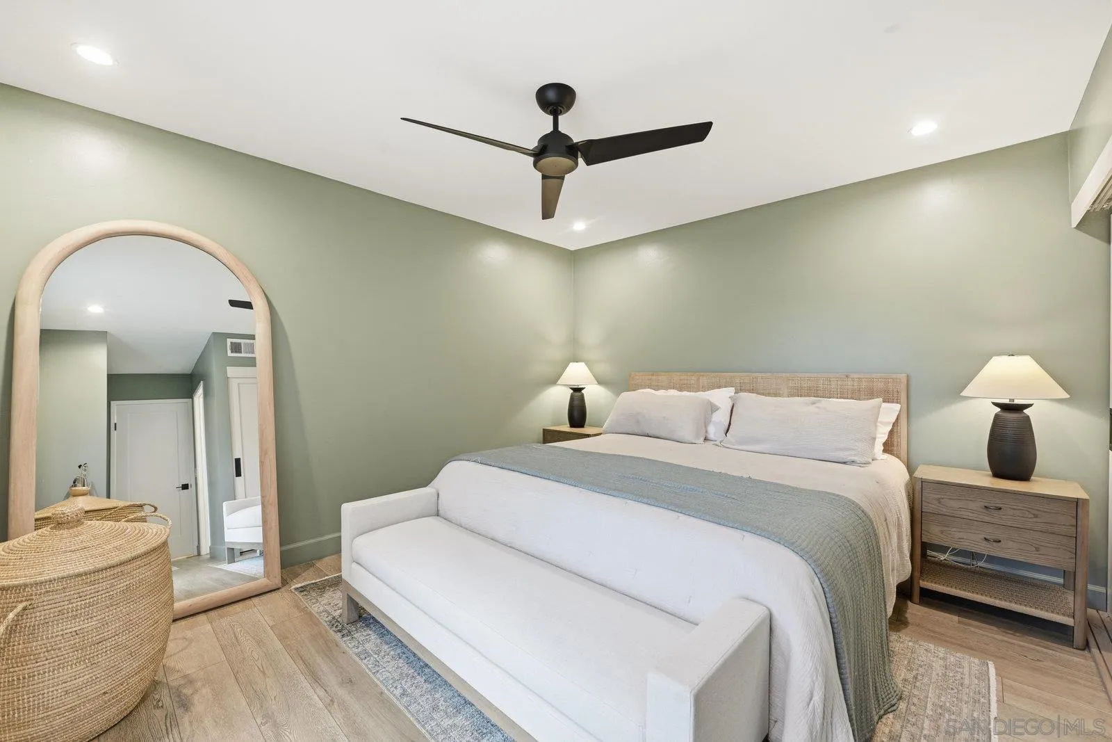 1422 Caminito Septimo Cardiff, CA 92007 - Photo 18 of 27 a bedroom with a bed and a chandelier