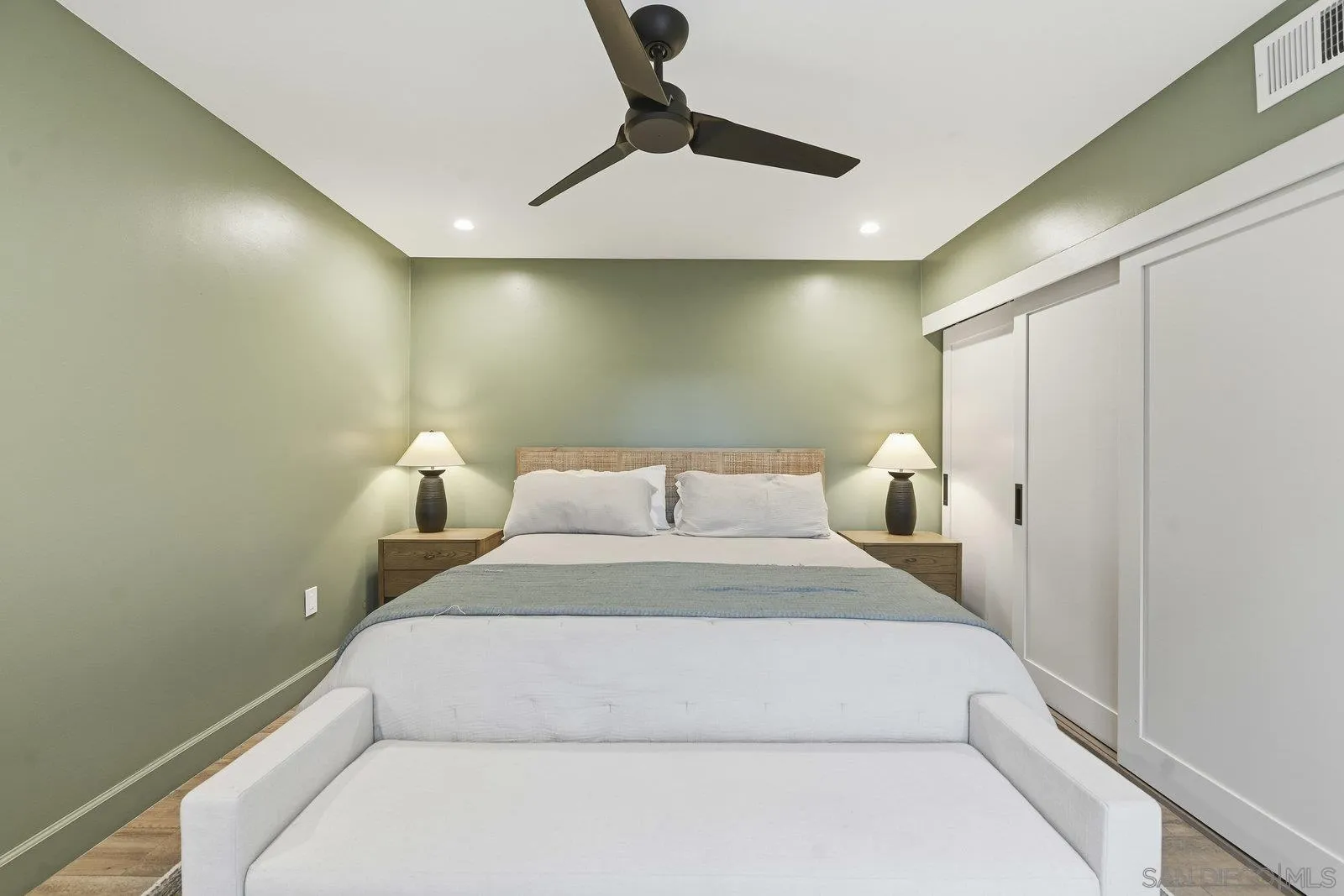 1422 Caminito Septimo Cardiff, CA 92007 - Photo 19 of 27 a bedroom with a bed and a ceiling fan