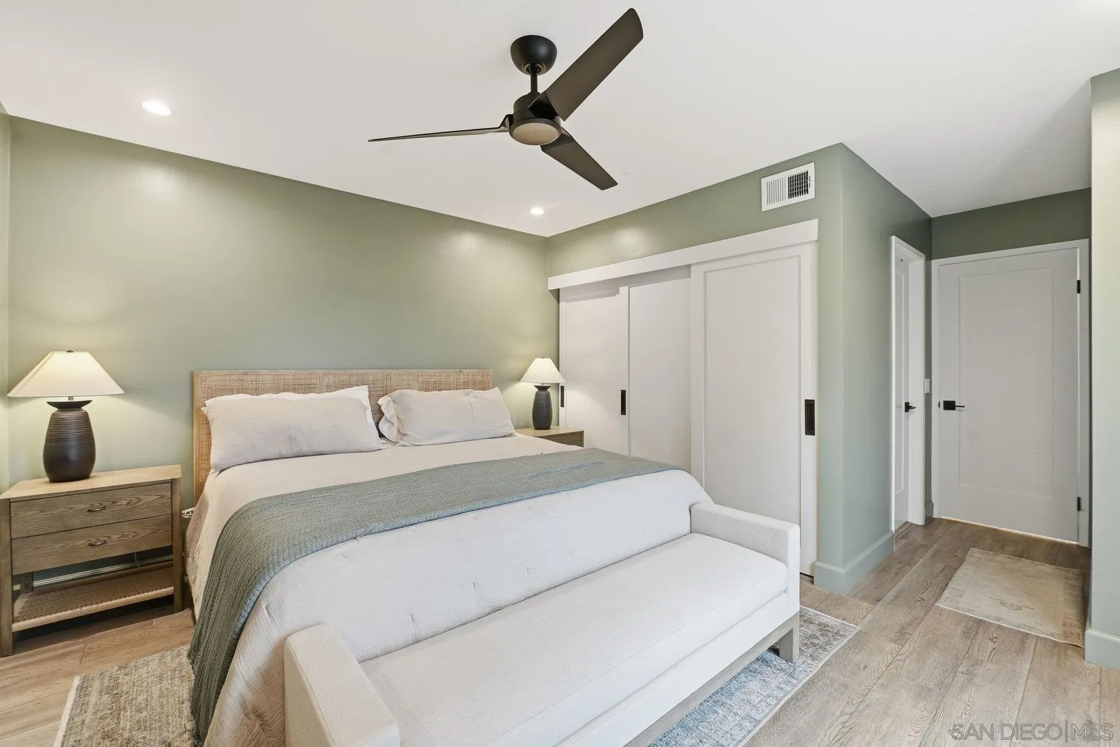 1422 Caminito Septimo Cardiff, CA 92007 - Photo 20 of 27 a bedroom with a bed and a lamp