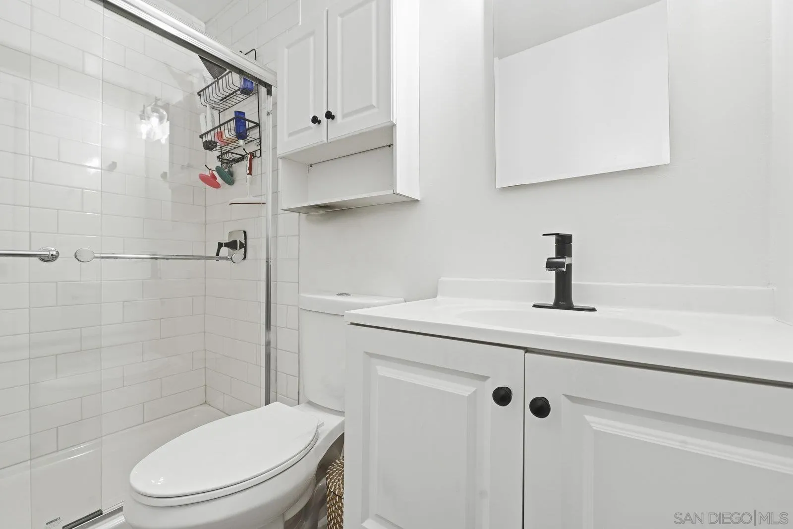 1422 Caminito Septimo Cardiff, CA 92007 - Photo 22 of 27 a bathroom with a toilet sink and shower