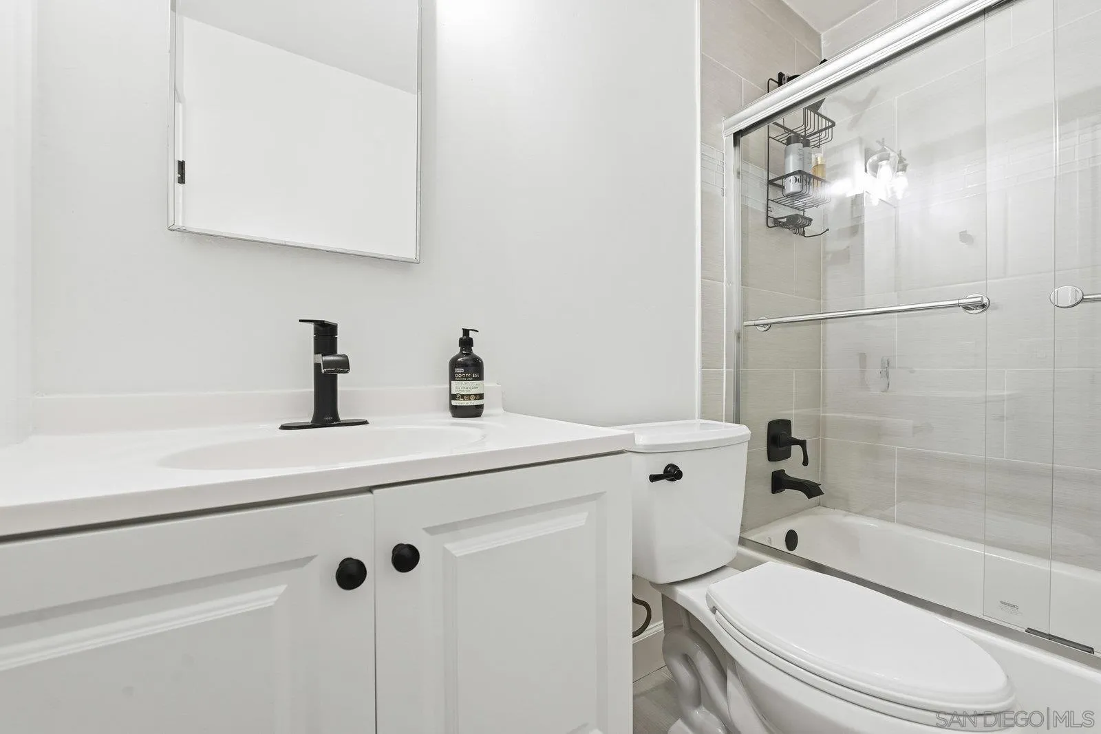 1422 Caminito Septimo Cardiff, CA 92007 - Photo 23 of 27 a bathroom with a sink a toilet and shower