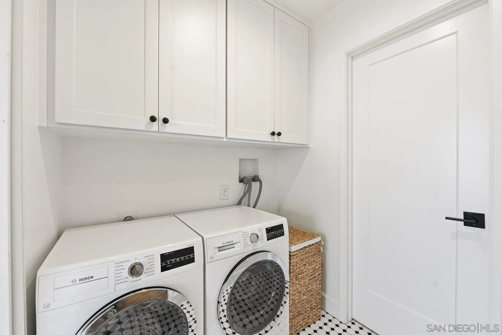 1422 Caminito Septimo Cardiff, CA 92007 - Photo 24 of 27 a view of washer and dryer with bathroom in the background