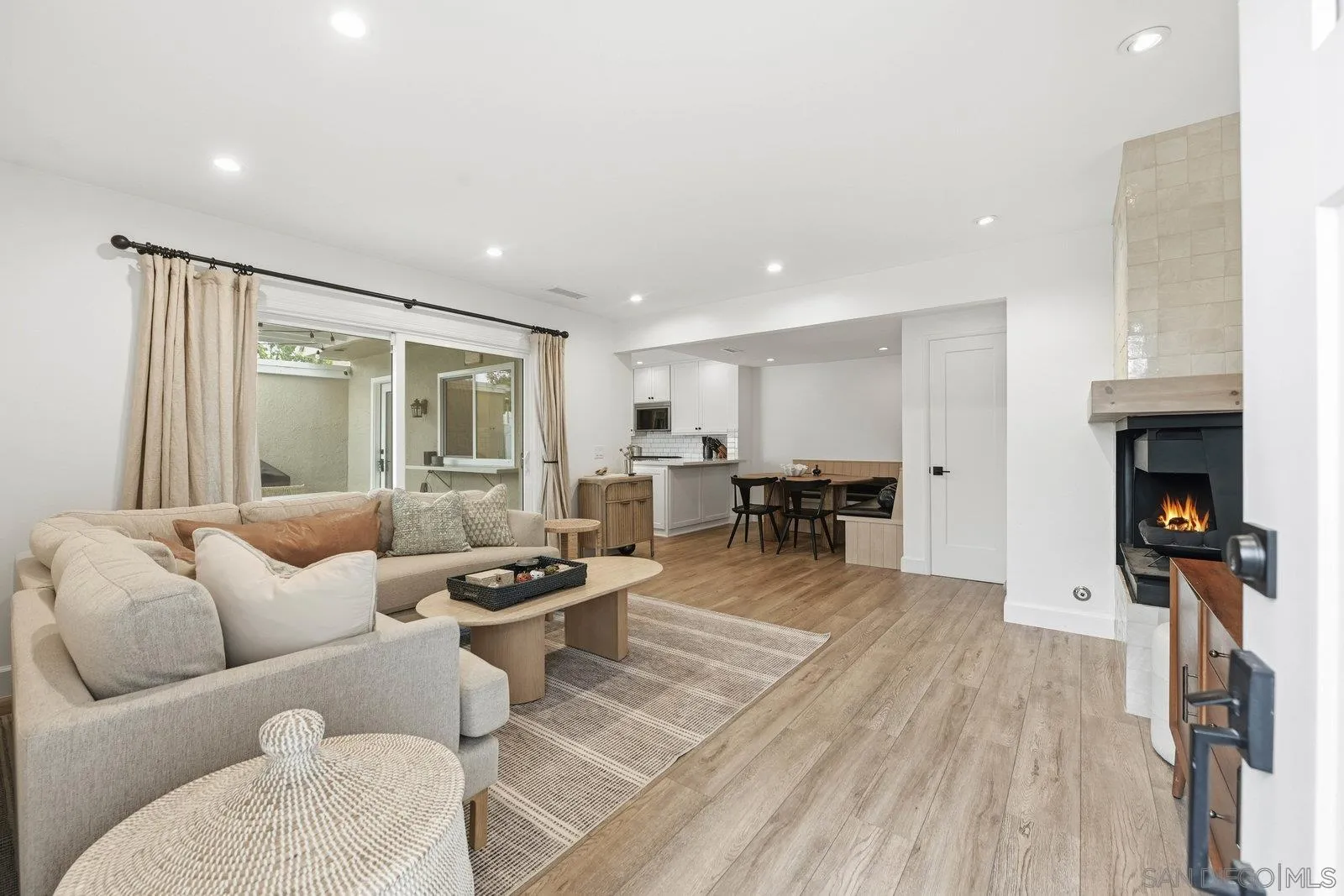 1422 Caminito Septimo Cardiff, CA 92007 - Photo 4 of 27 a living room with furniture and a fireplace