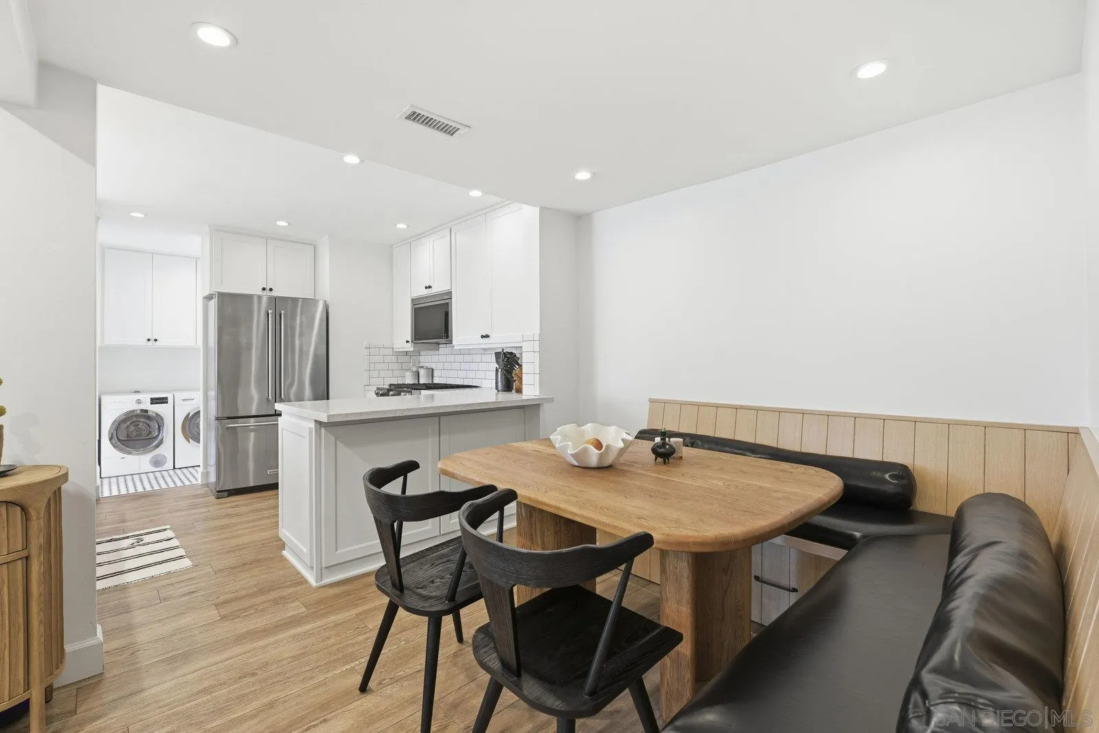 1422 Caminito Septimo Cardiff, CA 92007 - Photo 9 of 27 a view of a dining room with furniture and wooden floor