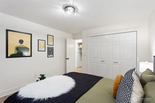 a bedroom with furniture and a window