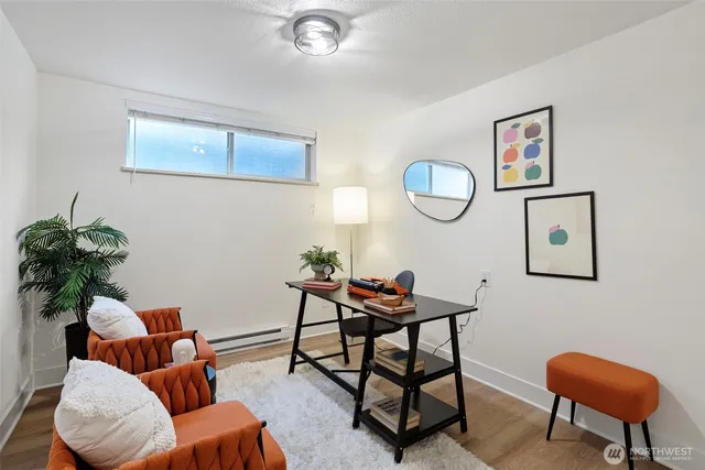 a living room with furniture and a chair