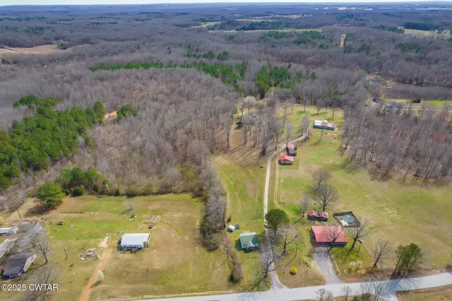 an aerial view of residential house with outdoor space