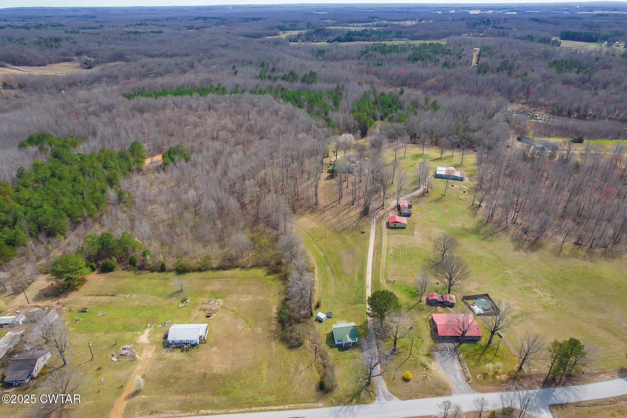 an aerial view of residential house with outdoor space
