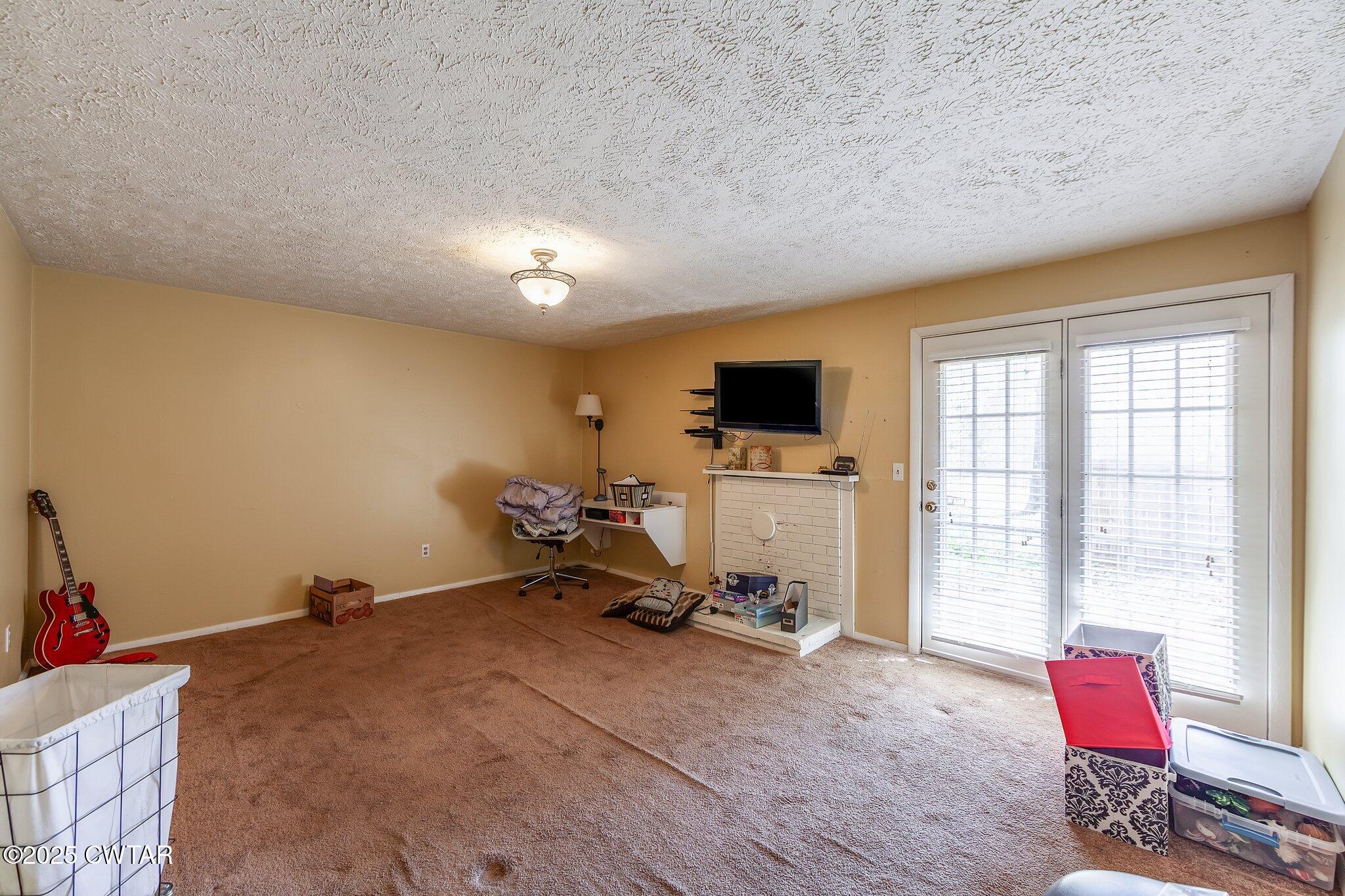 196 Pierce Road Beech Bluff, TN 38313 - Photo 11 of 63 a room with gym equipment and a window