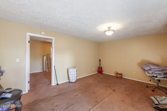 a living room filled with furniture and a wooden floor