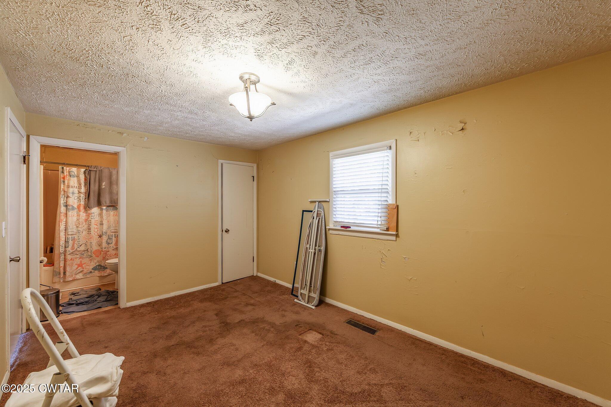 196 Pierce Road Beech Bluff, TN 38313 - Photo 15 of 63 a view of a livingroom with a workspace