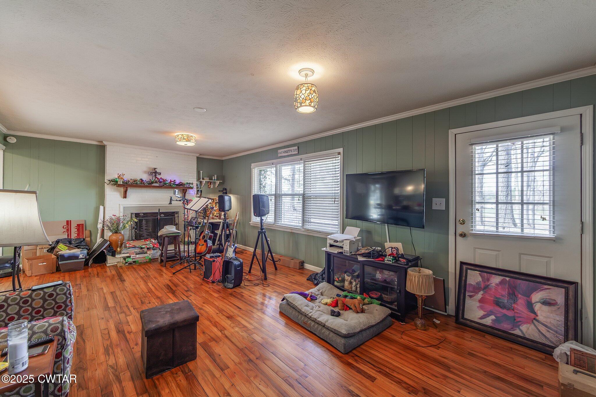196 Pierce Road Beech Bluff, TN 38313 - Photo 17 of 63 a living room filled with furniture and a wooden floor