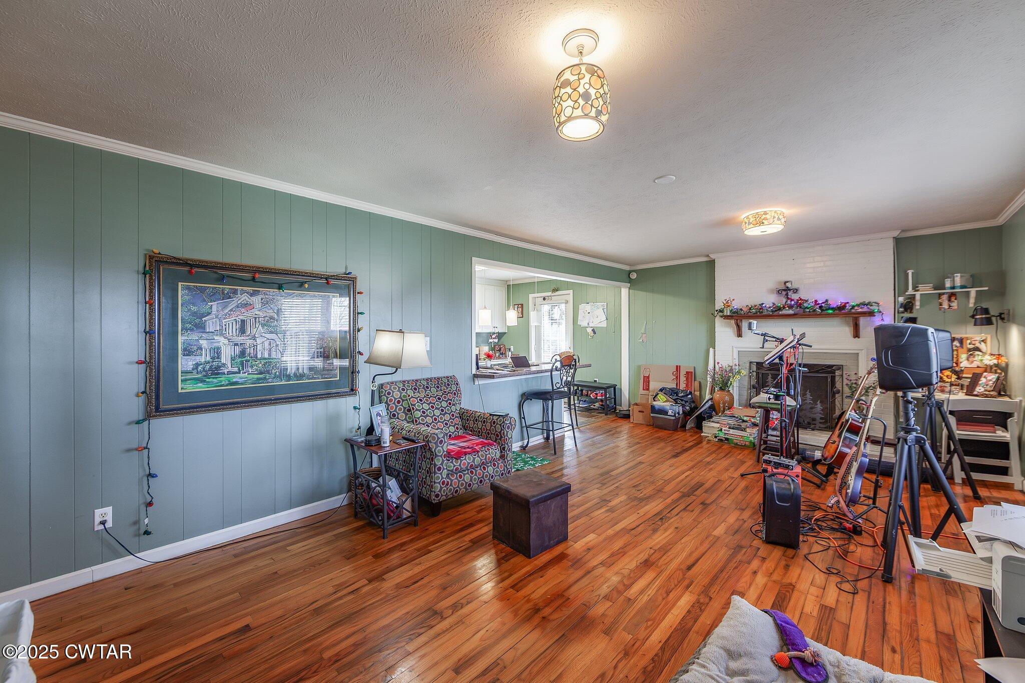 196 Pierce Road Beech Bluff, TN 38313 - Photo 18 of 63 a living room filled with furniture and a wooden floor