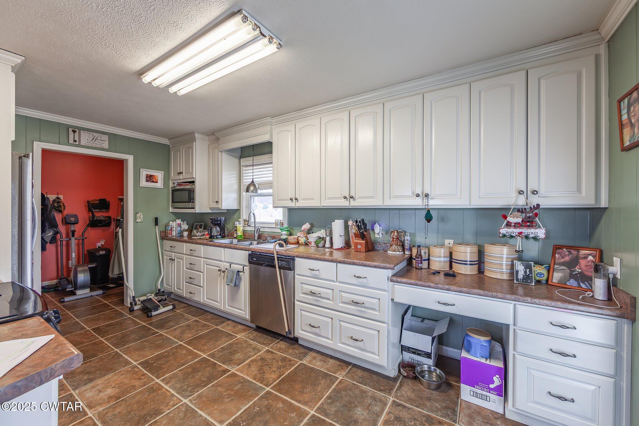 196 Pierce Road Beech Bluff, TN 38313 - Photo 20 of 63 a kitchen with cabinets appliances and a counter top space