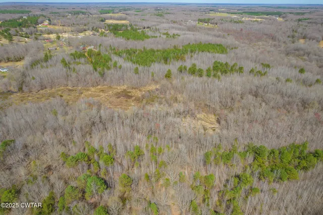 an aerial view of a house with outdoor space