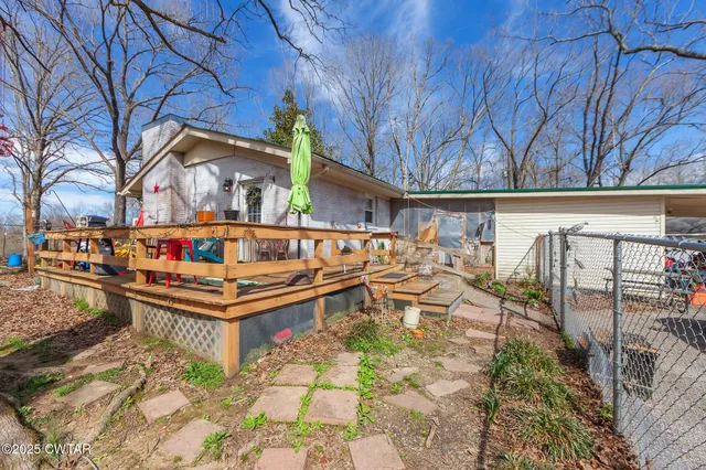a view of a backyard of the house