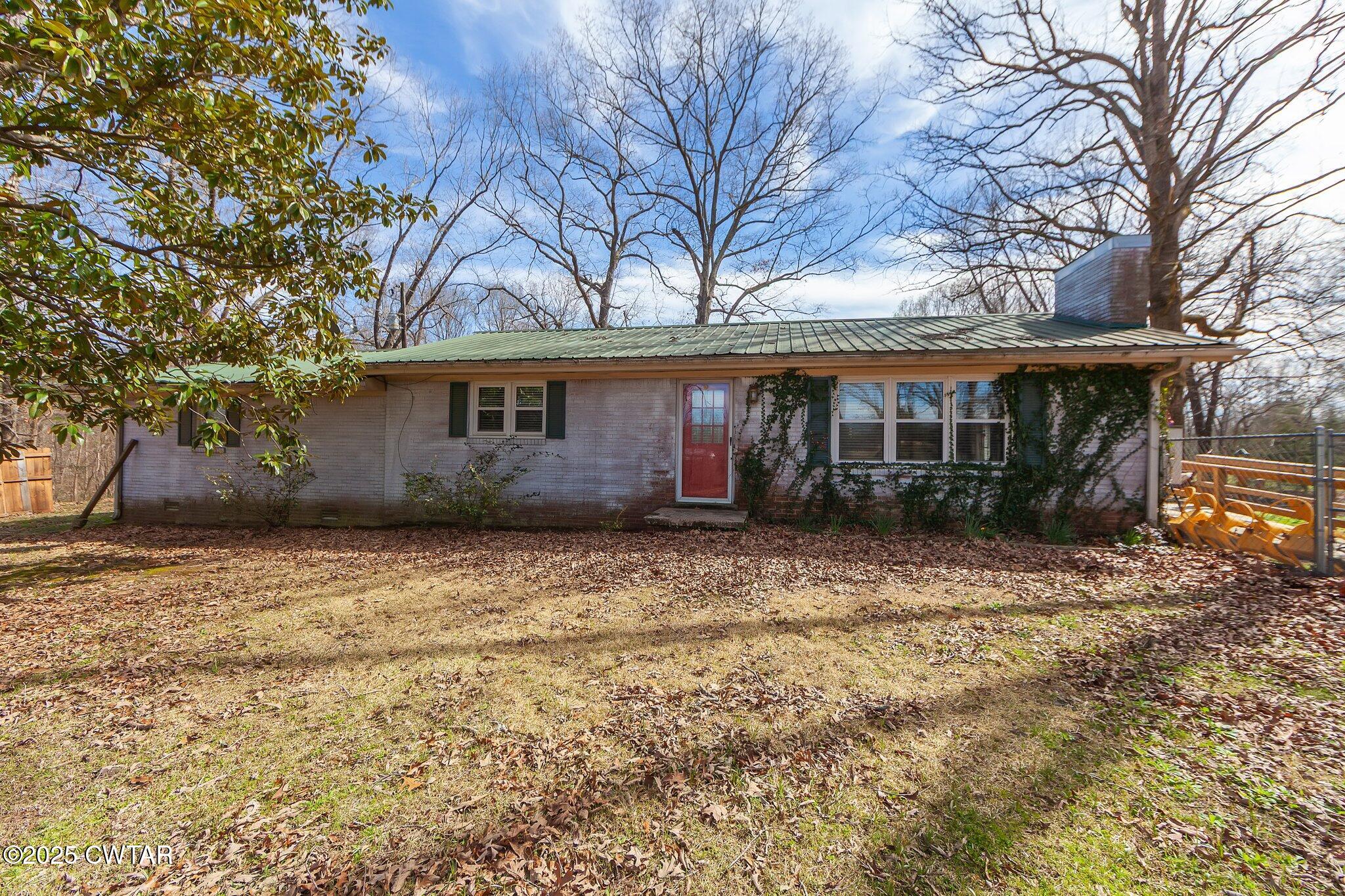 196 Pierce Road Beech Bluff, TN 38313 - Photo 43 of 63 a front view of a house with a garden