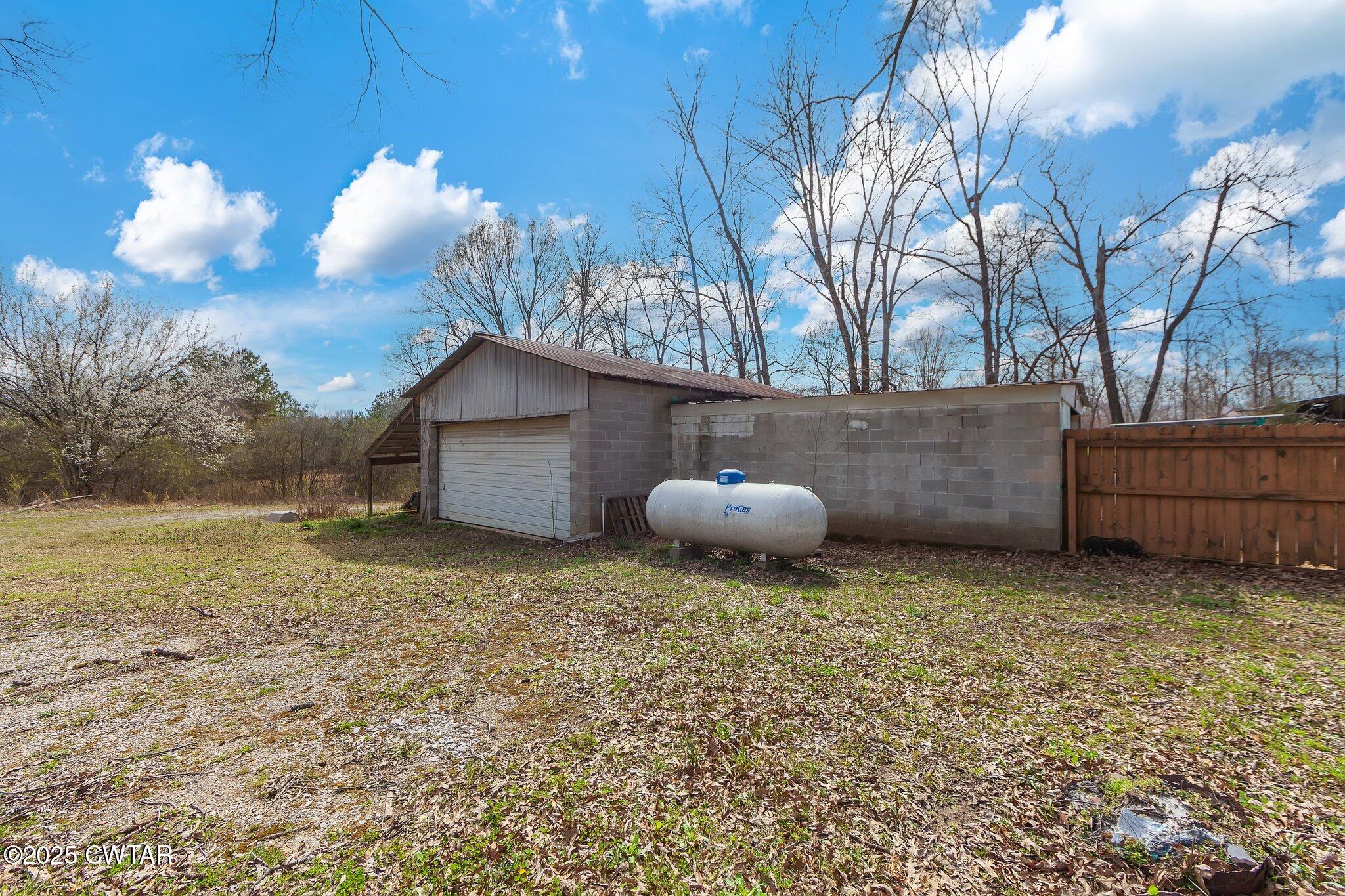 196 Pierce Road Beech Bluff, TN 38313 - Photo 47 of 63 a view of backyard and wooden fence