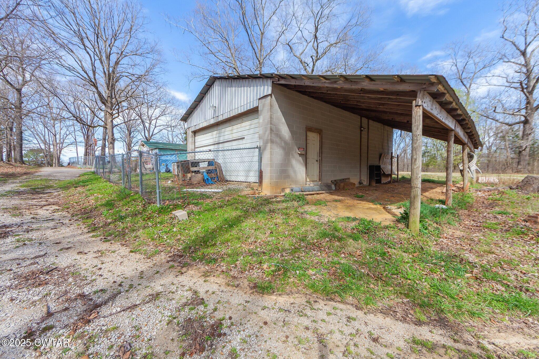 196 Pierce Road Beech Bluff, TN 38313 - Photo 48 of 63 a view of a house with a yard