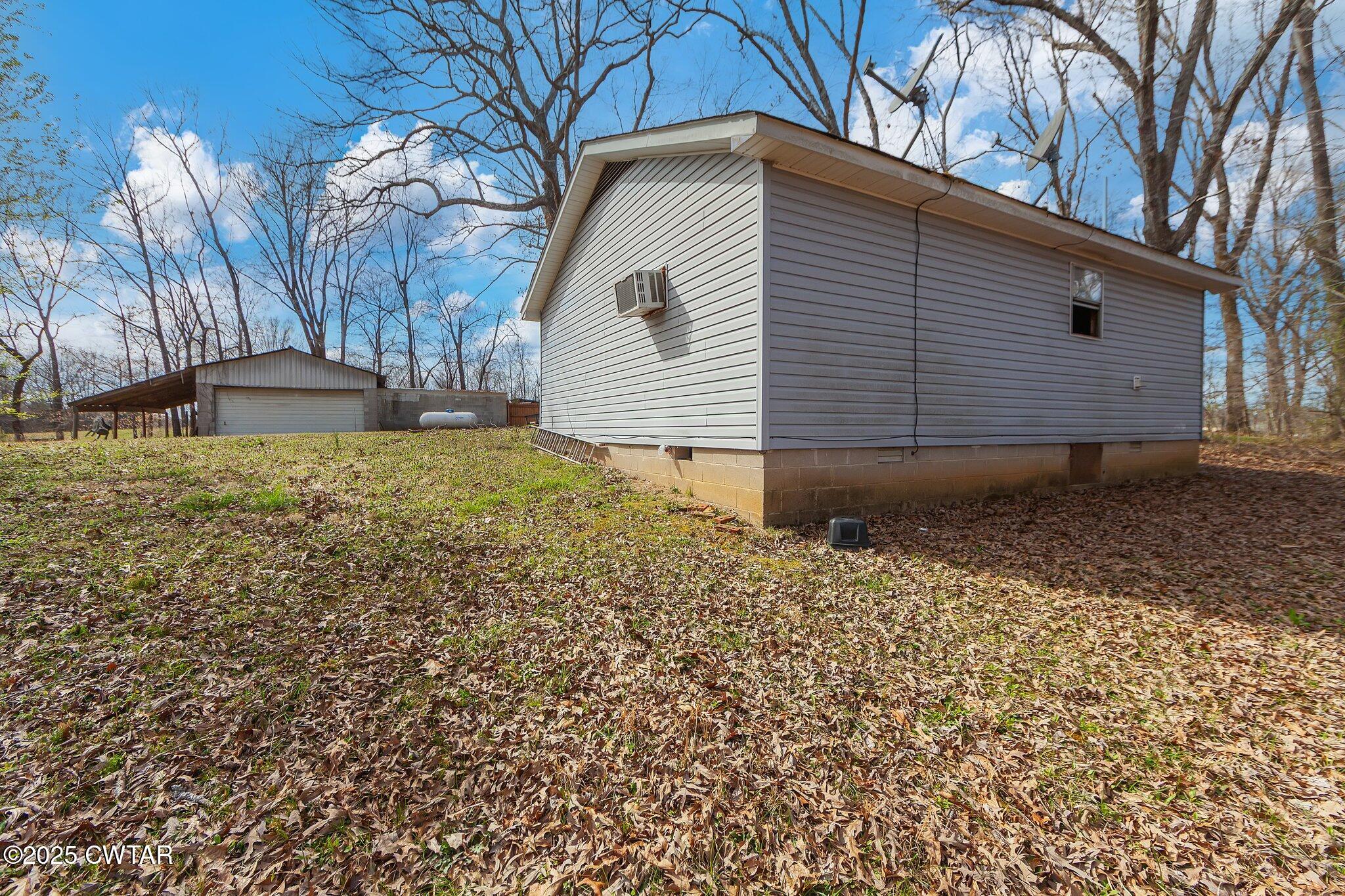 196 Pierce Road Beech Bluff, TN 38313 - Photo 52 of 63 a view of a backyard of the house