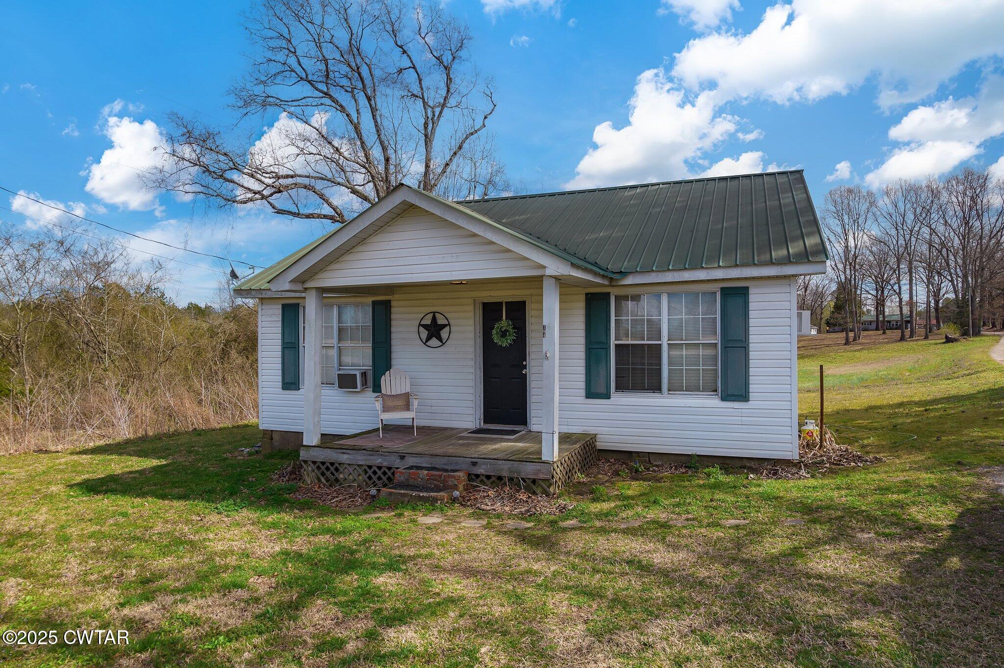 196 Pierce Road Beech Bluff, TN 38313 - Photo 53 of 63 a front view of a house with garden