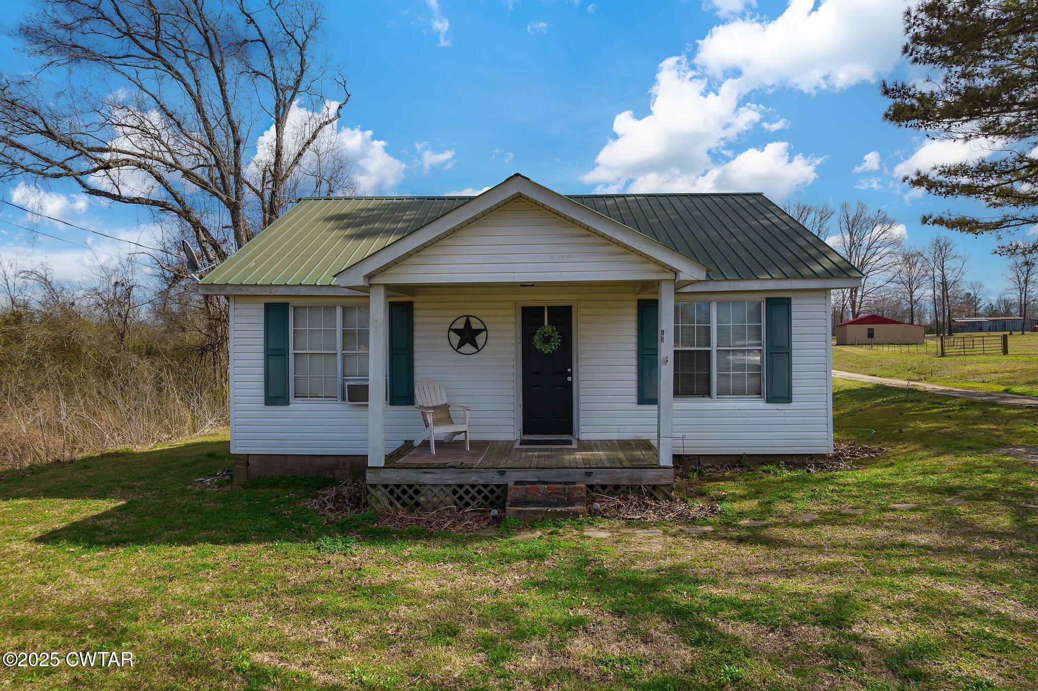 196 Pierce Road Beech Bluff, TN 38313 - Photo 54 of 63 a front view of a house with a yard