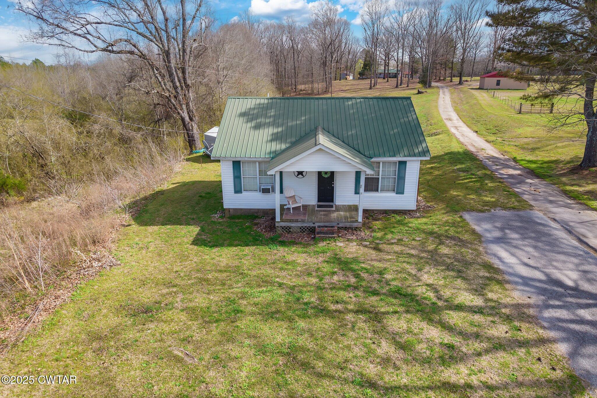 196 Pierce Road Beech Bluff, TN 38313 - Photo 56 of 63 a aerial view of a house with a yard