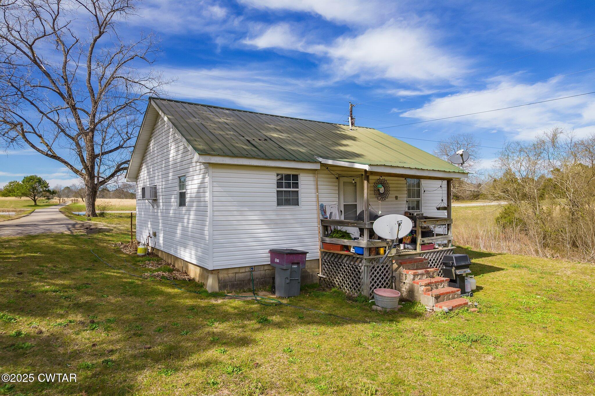 196 Pierce Road Beech Bluff, TN 38313 - Photo 59 of 63 a view of a house with backyard