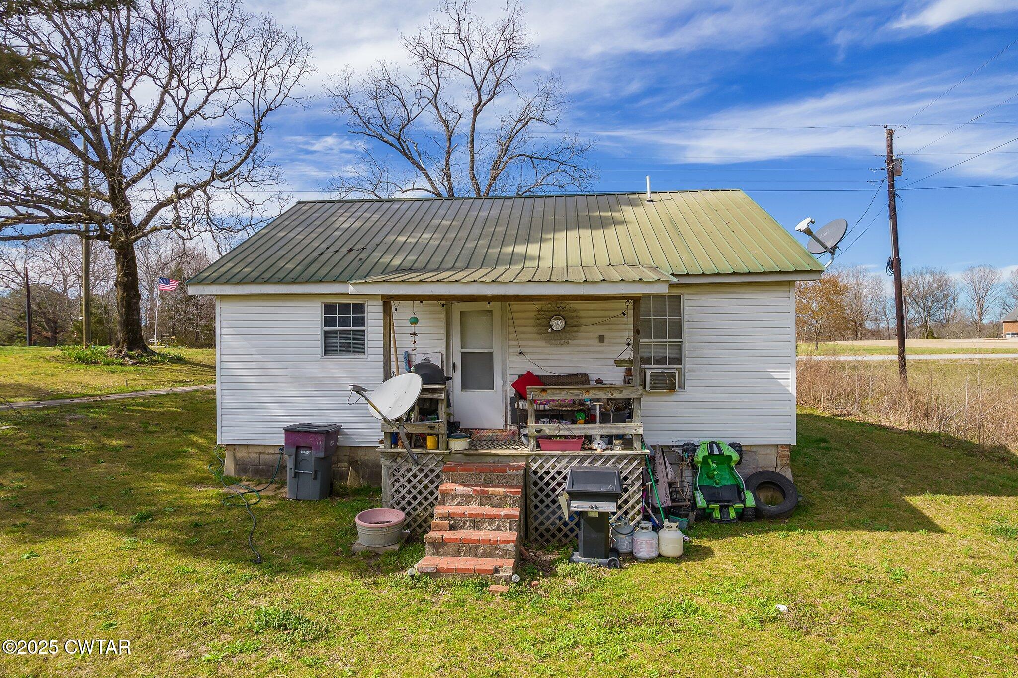 196 Pierce Road Beech Bluff, TN 38313 - Photo 60 of 63 a view of a house with backyard porch and sitting area