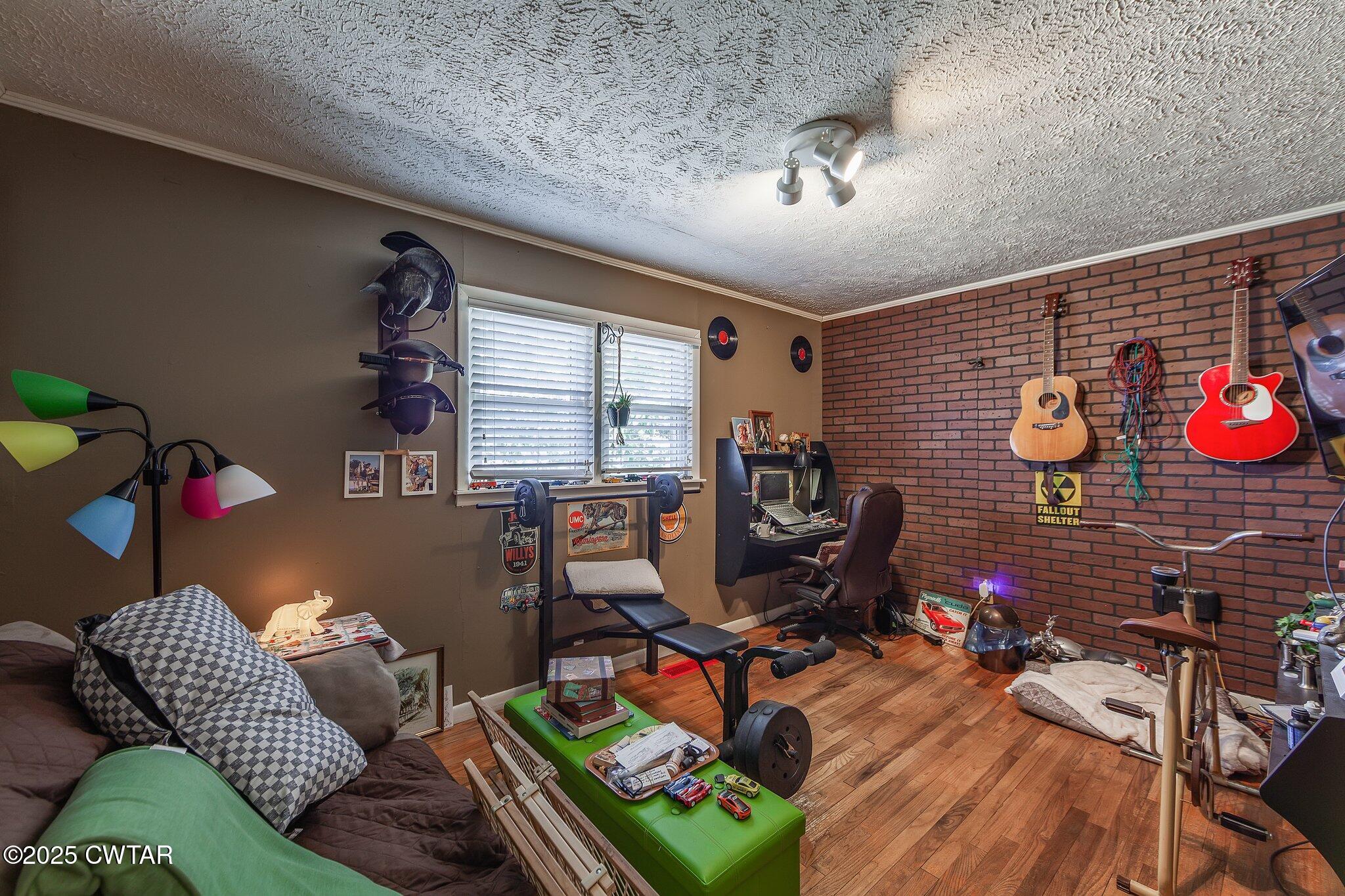 196 Pierce Road Beech Bluff, TN 38313 - Photo 7 of 63 a living room with furniture a rug and a floor to ceiling window
