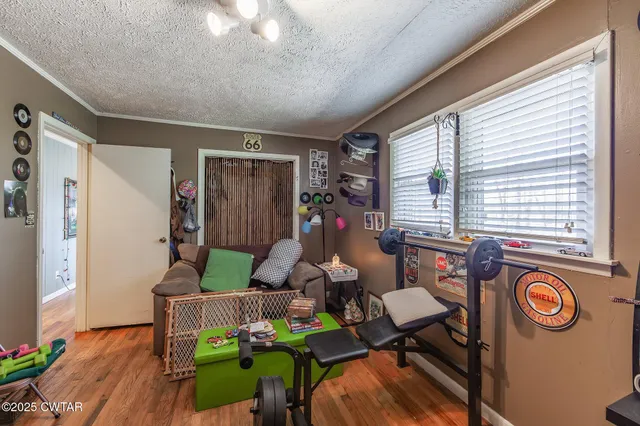 a room with gym equipment and a window