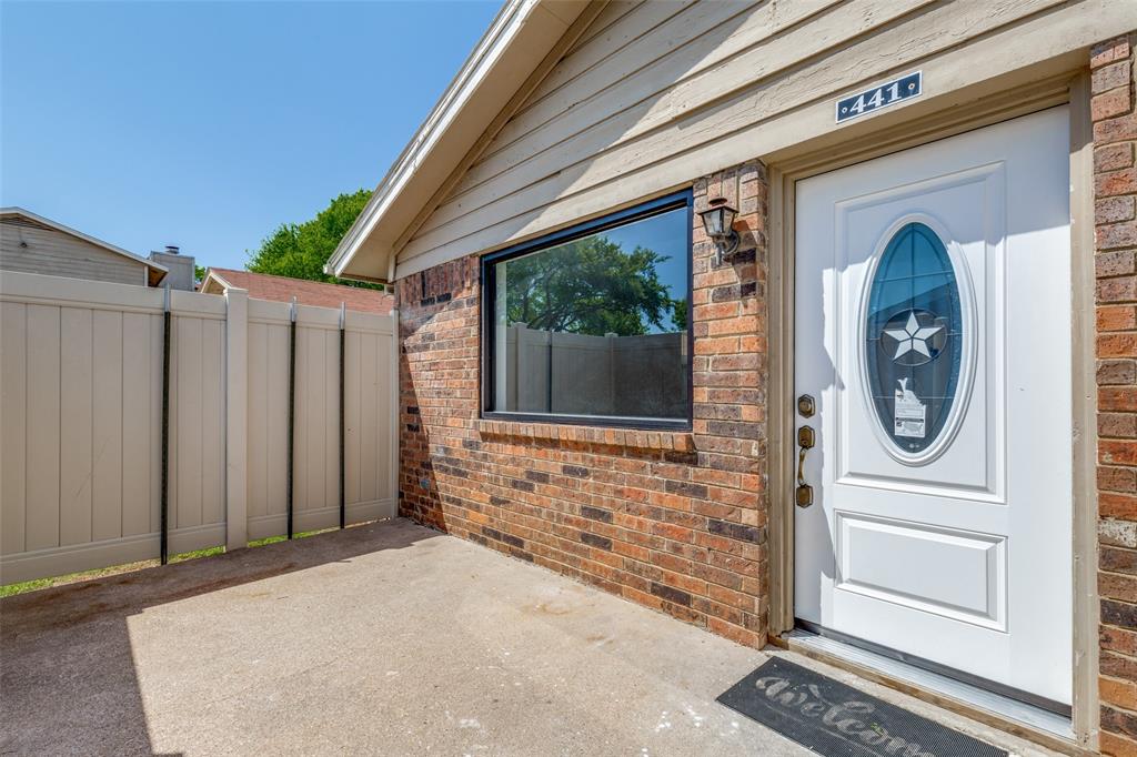 2240 Tarpley Road, Unit 441 Carrollton, TX 75006 - Photo 1 of 1 a front view of a house with garden