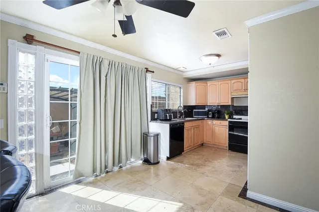a kitchen with a refrigerator and stove