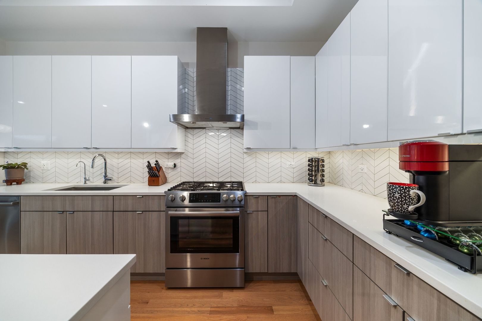2116 West Chicago Avenue, Unit 3W Chicago, IL 60622 - Photo 12 of 37 a kitchen with cabinets appliances and a sink