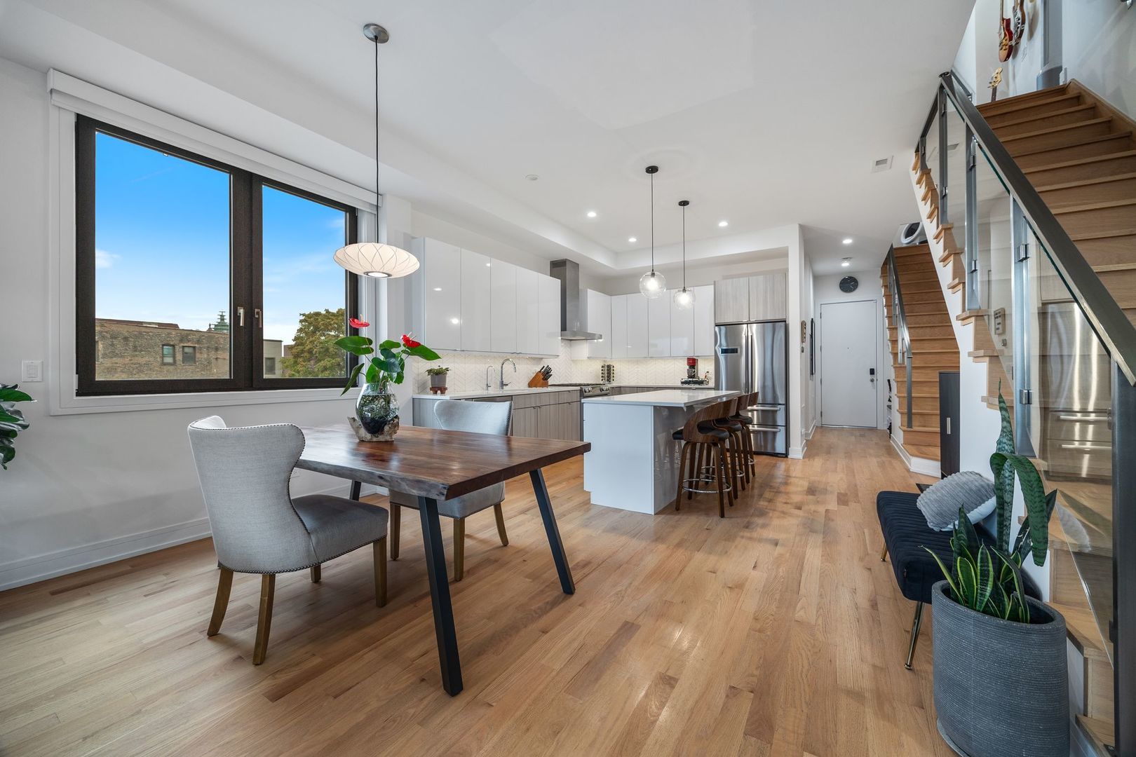 2116 West Chicago Avenue, Unit 3W Chicago, IL 60622 - Photo 13 of 37 a dining room with furniture and wooden floor