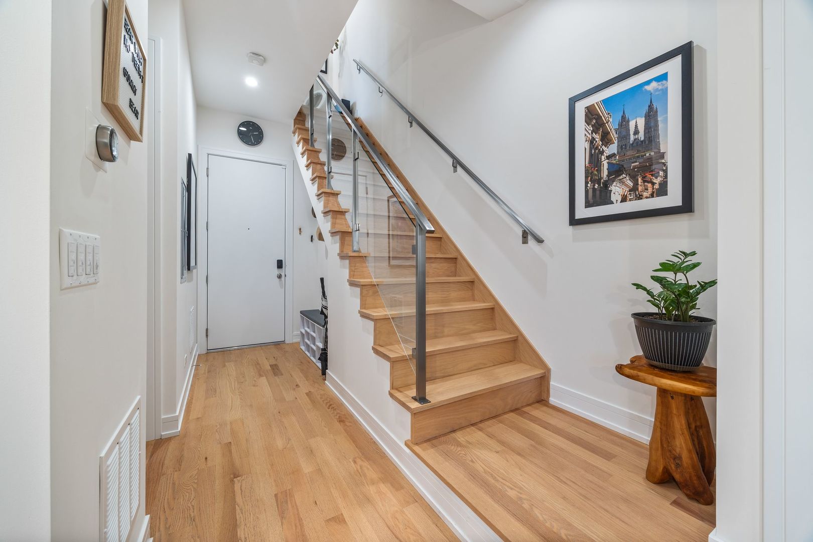 2116 West Chicago Avenue, Unit 3W Chicago, IL 60622 - Photo 14 of 37 a view of a hallway with wooden floor and stairs