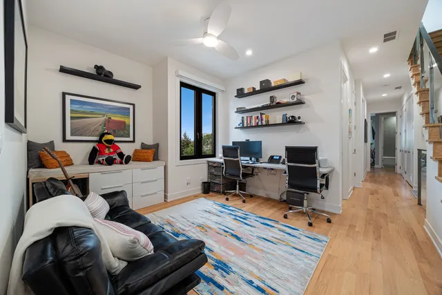 a bedroom with a bed and glass window