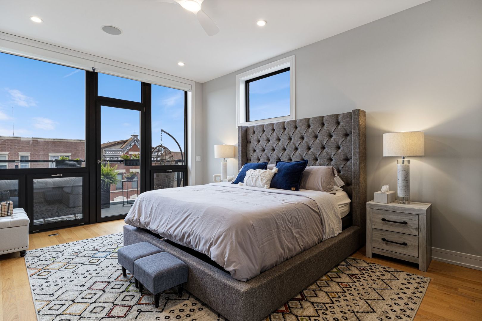 2116 West Chicago Avenue, Unit 3W Chicago, IL 60622 - Photo 18 of 37 a bedroom with a bed and glass window